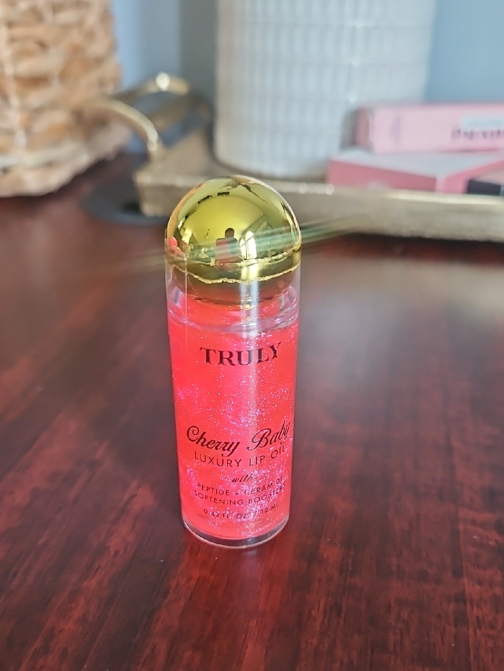 TRULY Cherry Bomb Lip Oil in Shimmery Red-Pink with Gold Cap